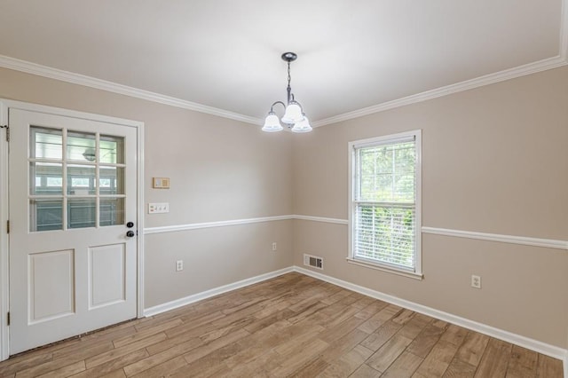 7928 S Giles Rd, Douglasville, GA 30135 - spare room featuring a chandelier, light wood-type flooring, baseboards, and ornamental molding