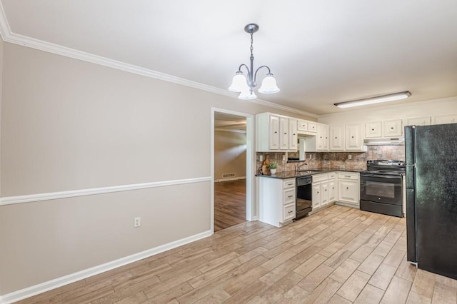 7928 S Giles Rd, Douglasville, GA 30135 - kitchen featuring black appliances, under cabinet range hood, a chandelier, a sink, and dark countertops