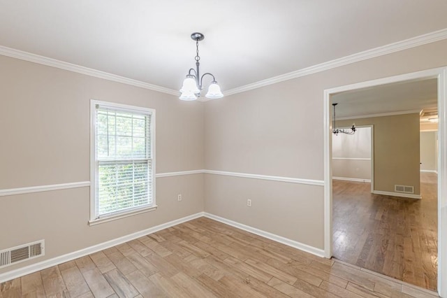 7928 S Giles Rd, Douglasville, GA 30135 - empty room featuring a chandelier, light wood-style floors, ornamental molding, and baseboards