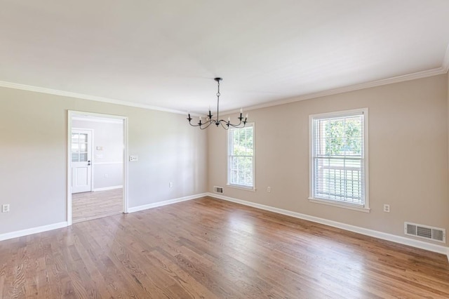7928 S Giles Rd, Douglasville, GA 30135 - unfurnished room with a chandelier, ornamental molding, wood finished floors, and baseboards