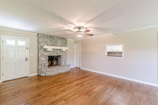 7928 S Giles Rd, Douglasville, GA 30135 - unfurnished living room with ceiling fan, ornamental molding, baseboards, wood finished floors, and a fireplace
