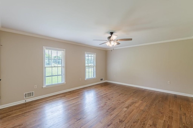 7928 S Giles Rd, Douglasville, GA 30135 - spare room featuring crown molding, ceiling fan, baseboards, and wood finished floors