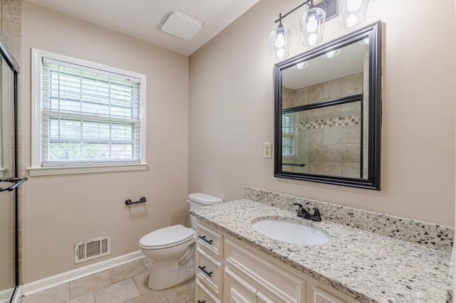 7928 S Giles Rd, Douglasville, GA 30135 - bathroom featuring toilet, vanity, tiled shower, tile patterned floors, and baseboards