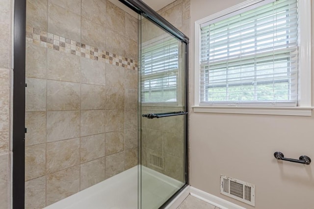7928 S Giles Rd, Douglasville, GA 30135 - bathroom featuring tiled shower and baseboards