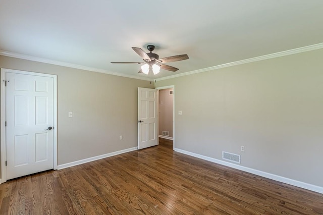 7928 S Giles Rd, Douglasville, GA 30135 - unfurnished bedroom with ornamental molding, baseboards, dark wood-style flooring, and a ceiling fan