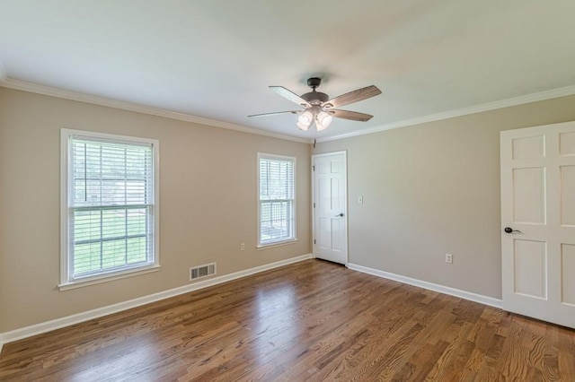7928 S Giles Rd, Douglasville, GA 30135 - empty room featuring crown molding, wood finished floors, a ceiling fan, and baseboards