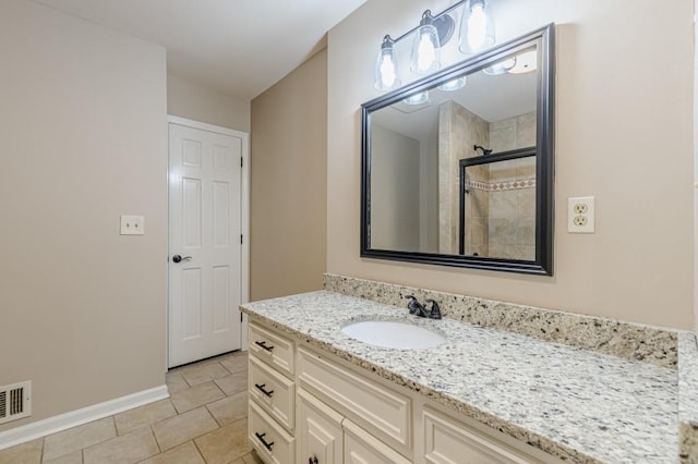 7928 S Giles Rd, Douglasville, GA 30135 - full bath with vanity, baseboards, tiled shower, and tile patterned flooring