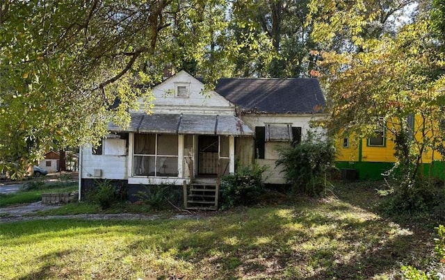 bungalow with a front yard