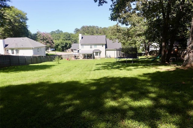 view of yard featuring a trampoline