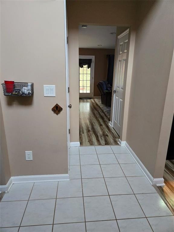 hall with light wood-type flooring