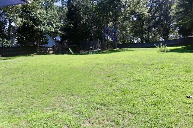 view of yard with a trampoline