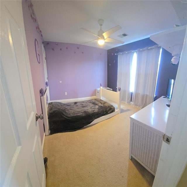 bedroom with ceiling fan and light colored carpet