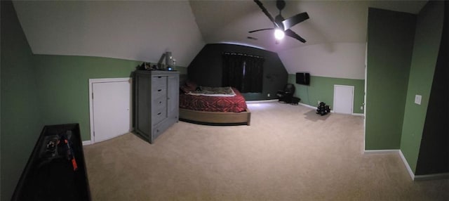 carpeted bedroom with ceiling fan and lofted ceiling