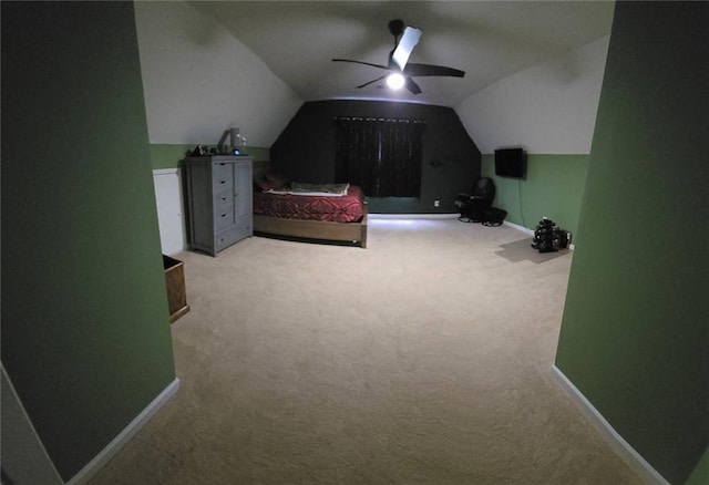 carpeted bedroom with vaulted ceiling and ceiling fan