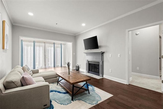 living room featuring hardwood / wood-style floors and crown molding