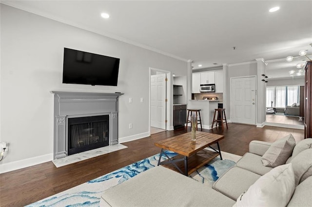 living room featuring ornamental molding and dark wood-type flooring