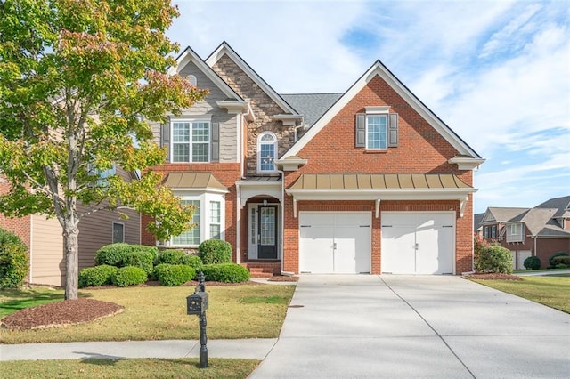 craftsman-style home with a front yard and a garage