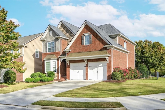 craftsman inspired home featuring a garage and a front lawn