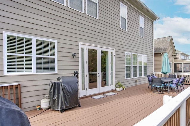 deck with area for grilling and french doors