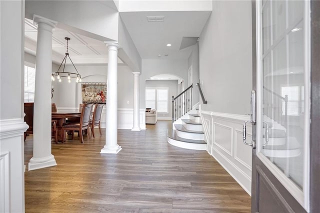 foyer featuring a healthy amount of sunlight and dark hardwood / wood-style floors