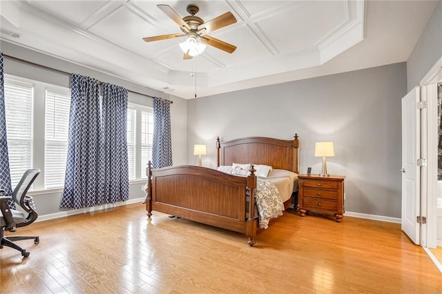 bedroom featuring coffered ceiling, ceiling fan, ornamental molding, and light hardwood / wood-style flooring