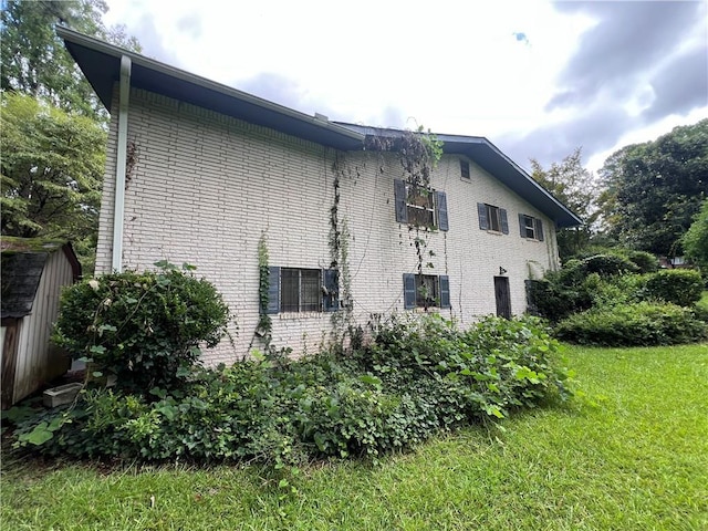 2323 Valleyside Dr, Decatur, GA 30032 - view of property exterior with brick siding and a lawn