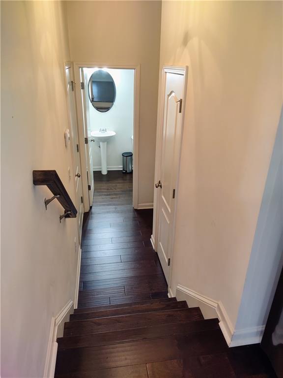 hallway featuring dark wood-type flooring