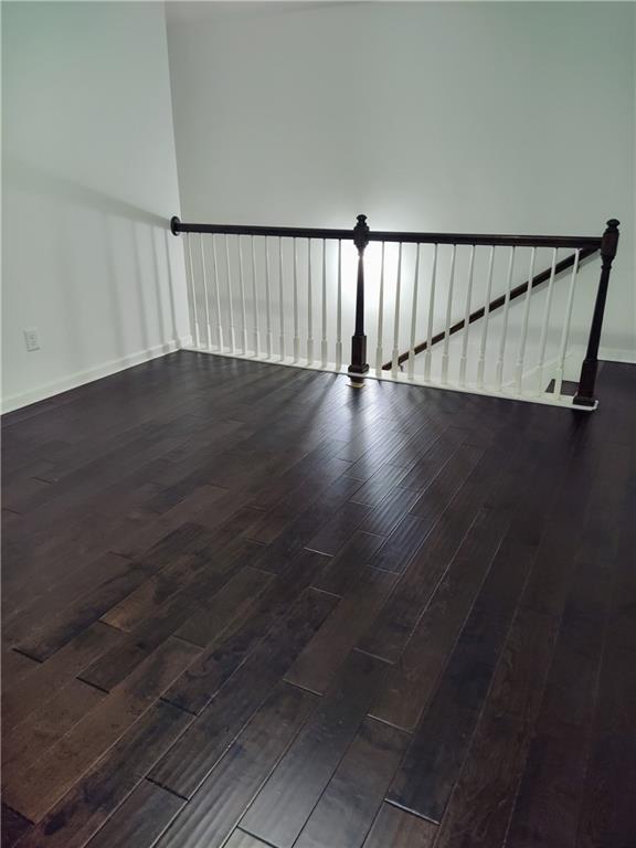 staircase with hardwood / wood-style flooring