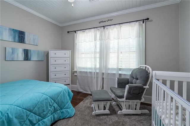 bedroom featuring ornamental molding and dark wood-type flooring