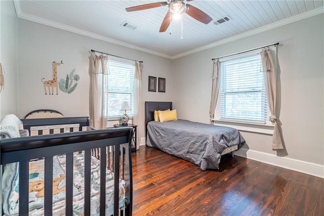 bedroom with ornamental molding, dark wood-type flooring, and visible vents