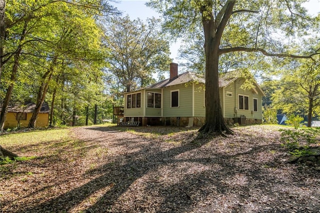 view of side of property featuring a chimney