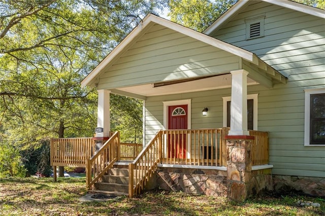 property entrance featuring covered porch