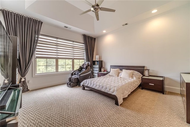 bedroom with ceiling fan, lofted ceiling, and light carpet