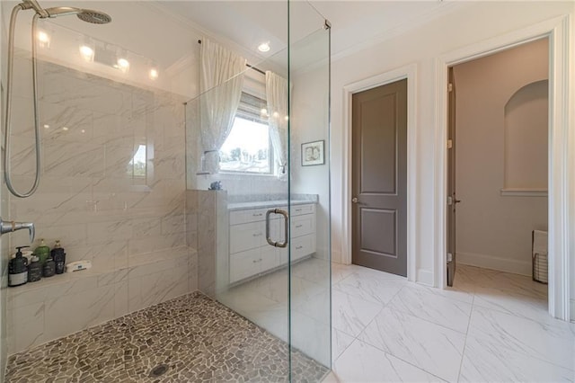 bathroom featuring a shower with door and ornamental molding