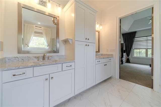 bathroom with ceiling fan, crown molding, and vanity