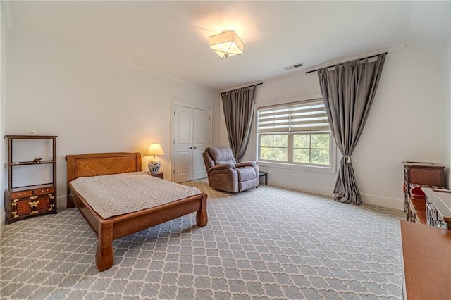 bedroom with carpet and ornamental molding