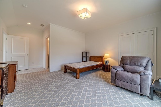 carpeted bedroom featuring lofted ceiling and ornamental molding