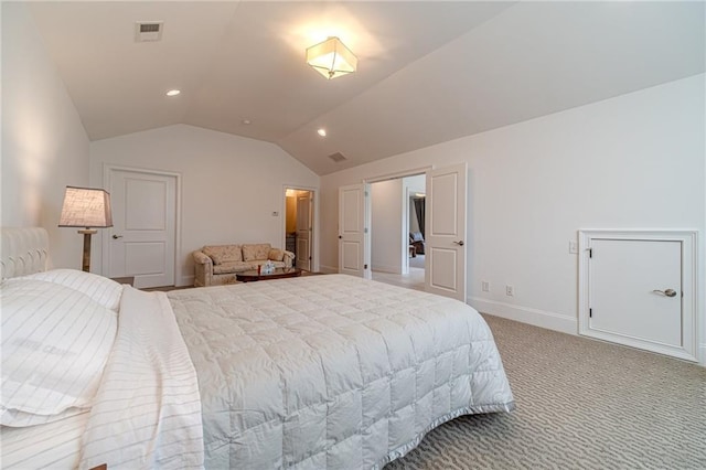 carpeted bedroom with vaulted ceiling