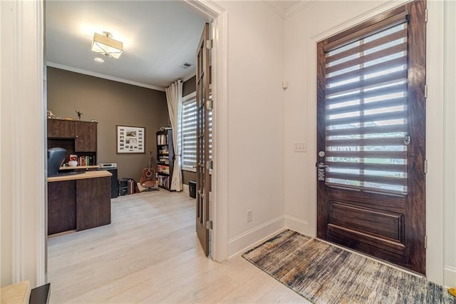 entrance foyer with light wood-type flooring and ornamental molding