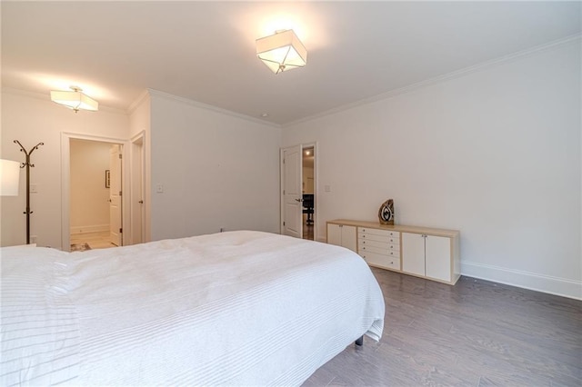 bedroom featuring ensuite bathroom and crown molding