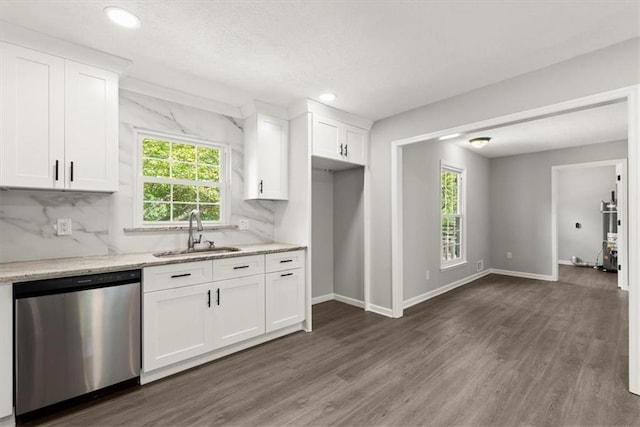 kitchen featuring a sink, a healthy amount of sunlight, decorative backsplash, and stainless steel dishwasher