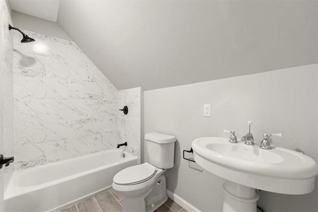 full bath featuring baseboards, toilet, vaulted ceiling, shower / bathing tub combination, and a sink