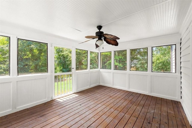 unfurnished sunroom with a ceiling fan