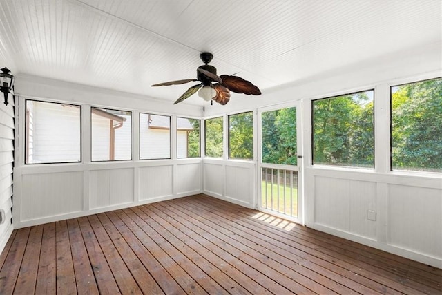 unfurnished sunroom with a ceiling fan