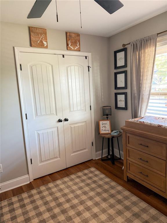 45 Albright Ct, Commerce, GA 30529 - bedroom featuring baseboards, a ceiling fan, wood finished floors, and a closet