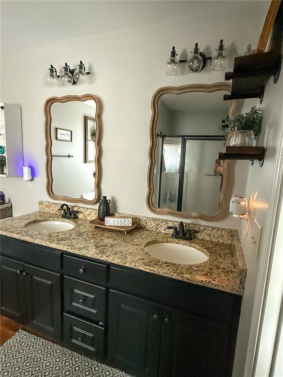 45 Albright Ct, Commerce, GA 30529 - full bathroom with an enclosed shower, a sink, and double vanity