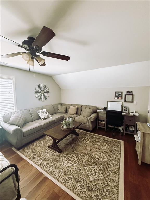 45 Albright Ct, Commerce, GA 30529 - living room featuring lofted ceiling, a ceiling fan, and dark wood-style floors