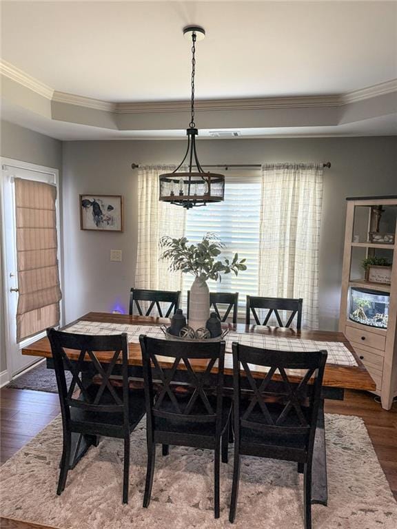 45 Albright Ct, Commerce, GA 30529 - dining space featuring dark wood finished floors, baseboards, crown molding, and a tray ceiling