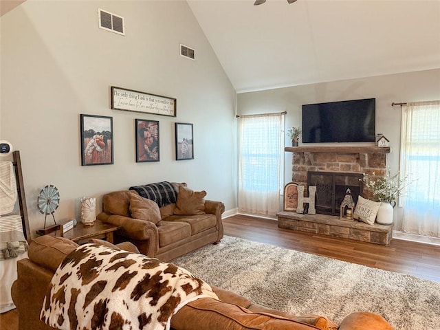 45 Albright Ct, Commerce, GA 30529 - living area with high vaulted ceiling, ceiling fan, wood finished floors, and visible vents