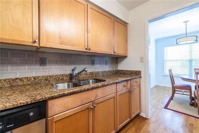 1150 Collier Rd NW Unit G8, Atlanta, GA 30318 - kitchen featuring dishwasher, light wood-style flooring, dark stone counters, and backsplash